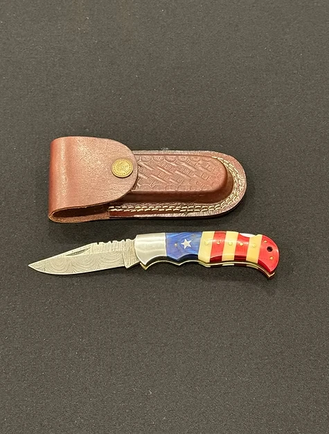A foldable pocket knife with an American flag.