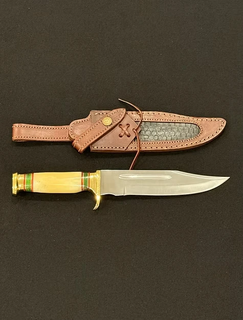 A knife with a gold blade 
