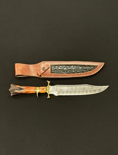A knife with a brown leather sheath 