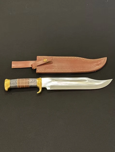 A knife with wooden hilt and leather sheath 