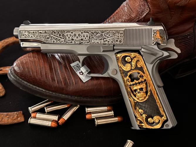 A custom handgun featuring 24K gold-plated grips and zirconia detailing.
