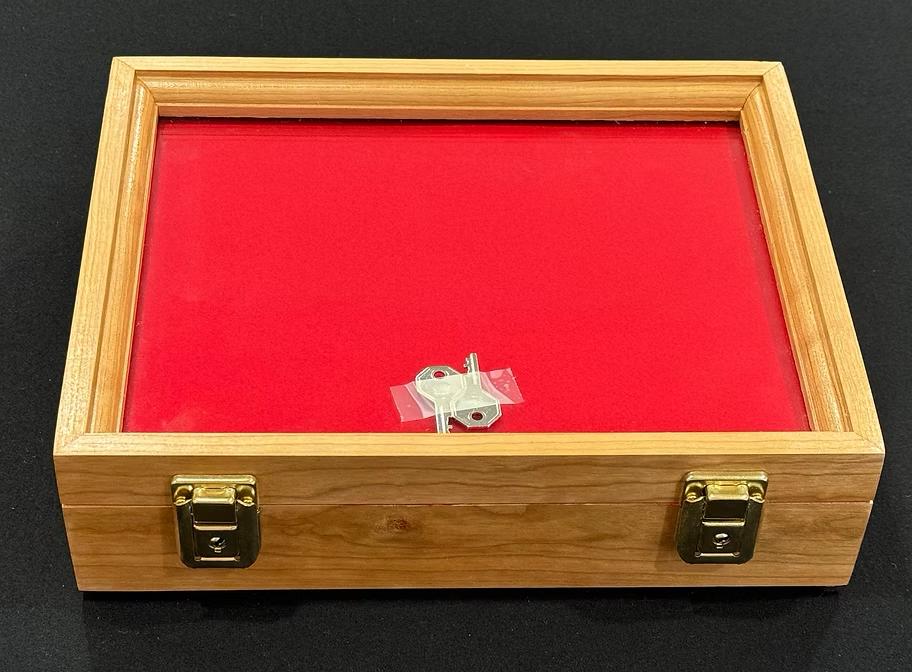 A large, elegant wooden gun display case