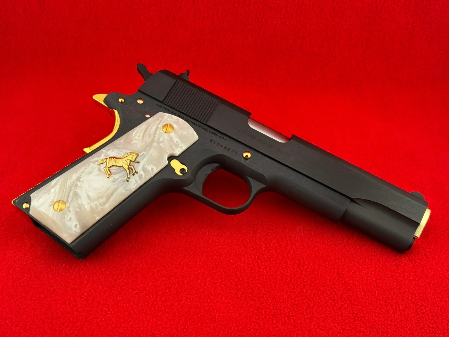 A customized gun with a white handle.