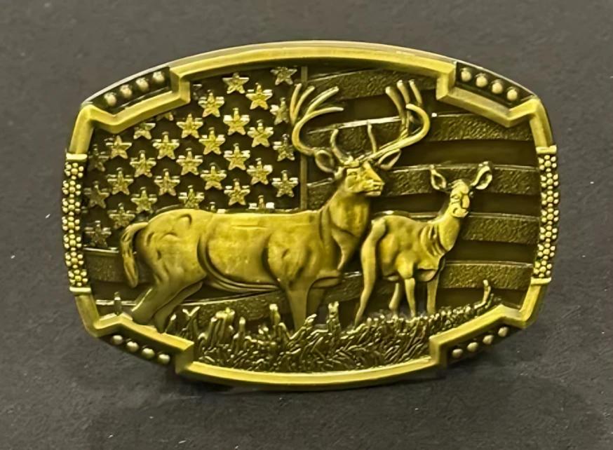 A cowboy belt buckle with deer.