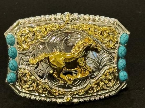 A cowgirl buckle made using horse silver & gold with turquoise stone