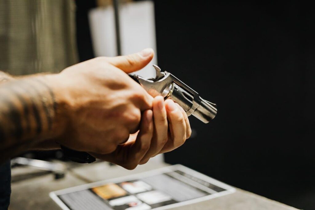 A person holds a gun